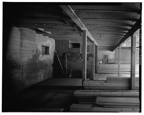  INTERIOR OF GROUND FLOOR, LOOKING NORTH-NORTHEAST THROUGH ANIMAL STALLS AREA. - Santa Ana River Hydroelectric System, SAR-1 Stable, Redlands, San Bernardino County, CA