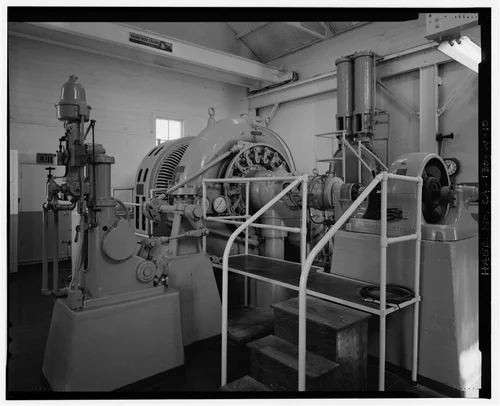  GOVERNOR, PELTON REACTION TURBINE, AND EXCITER. VIEW TO NORTH. - Santa Ana River Hydroelectric System, SAR-3 Powerhouse, Redlands, San Bernardino County, CA