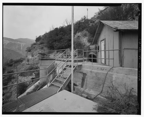  SAR-3 FOREBAY, SHOWING PENSTOCKS AND TUNNEL PORTAL FOR WATER ENTERING FOREBAY. VIEW TO NORTH. - Santa Ana River Hydroelectric System, SAR-3 Forebay & Penstock, Redlands, San Bernardino County, CA