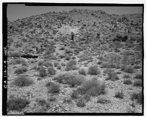  VIEW OF PINTO WYE LANDSCAPE LOOKING NORTH, ARRASTRA AT CENTER LEFT EDGE, TAILINGS AT CENTER REAR  - Pinto Wye Arrastra, Twentynine Palms, San Bernardino County, CA