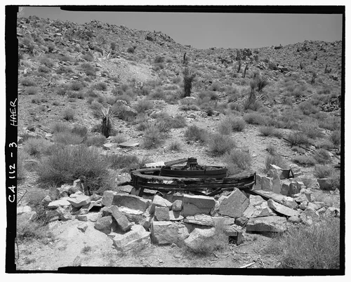  LOOKING NORTH NORTHEAST AT ARRASTRA, TAILINGS TO LEFT OF CENTER REAR, STANDING ROCKS TO RIGHT OF CENTER REAR - Pinto Wye Arrastra, Twentynine Palms, San Bernardino County, CA