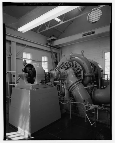  EXCITER, REACTION TURBINE, AND PENSTOCK/TAILRACE CONNECTOR PIPES. VIEW TO NORTHWEST. - Santa Ana River Hydroelectric System, SAR-3 Powerhouse, Redlands, San Bernardino County, CA