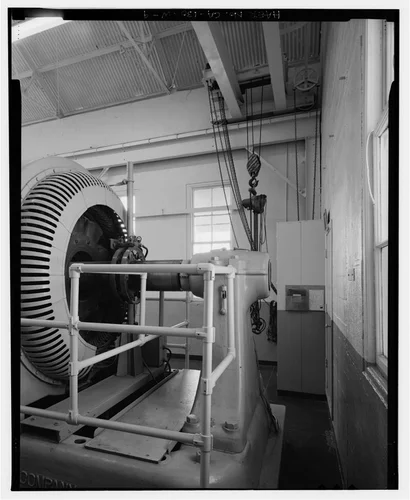  GENERATOR, AND CRANE IN NORTHWEST CORNER OF POWERHOUSE. VIEW TO SOUTHWEST. - Santa Ana River Hydroelectric System, SAR-3 Powerhouse, Redlands, San Bernardino County, CA