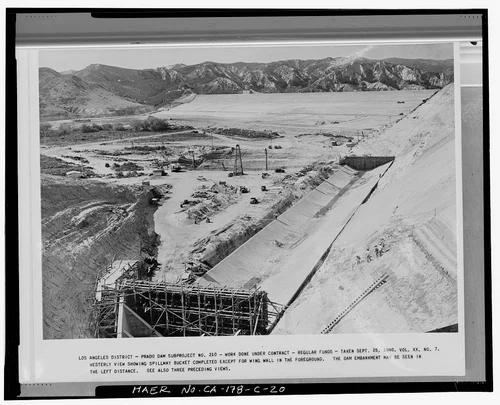  WESTERLY VIEW SHOWING SPILLWAY BUCKET COMPLETED, EXCEPT FOR WING WALL IN THE FOREGROUND.... Volume XX, No. 7, September 25, 1940. - Prado Dam, Spillway, Santa Ana River near junction of State Highways 71 & 91, Corona, Riverside County, CA
