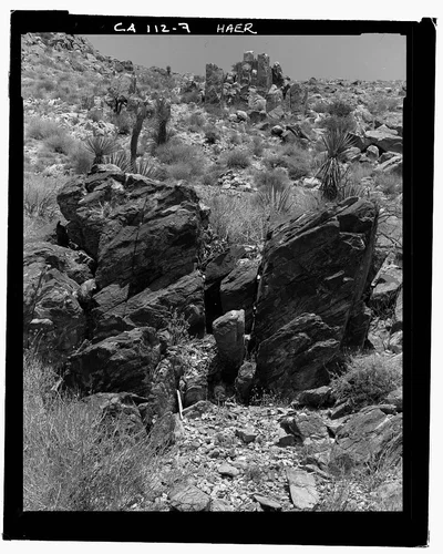  LOCATION MARKERS - NOTCH IN FOREGROUND, STANDING ROCKS AT REAR WITH MARKER PILE CENTER  - Pinto Wye Arrastra, Twentynine Palms, San Bernardino County, CA