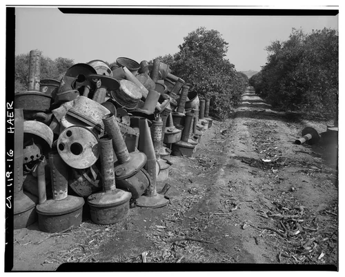  VIEW OF SMUDGE POTS IN ORANGE GROVE ON VICTORIA AVENUE - Arlington Heights Citrus Landscape, Southwestern portion of city of Riverside, Riverside, Riverside County, CA