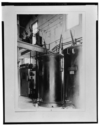  TELEPHONE BOOTH (LEFT), TRANSFORMERS (RIGHT), AND OIL CIRCUIT BREAKERS (TOP). SCE negative no. 10341, November 1, 1923. Photograph by G. Haven Bishop. - Santa Ana River Hydroelectric System, SAR-3 Powerhouse, Redlands, San Bernardino County, CA