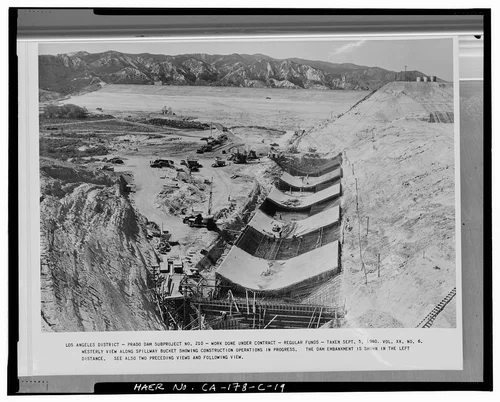  WESTERLY VIEW ALONG SPILLWAY BUCKET, SHOWING CONSTRUCTION OPERATIONS IN PROGRESS. THE DAM EMBANKMENT IS SHOWN IN THE LEFT DISTANCE.... Volume XX, No. 6, September 5, 1940. - Prado Dam, Spillway, Santa Ana River near junction of State Highways 71 & 91, Corona, Riverside County, CA