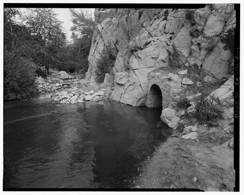  WATER ENTERING CONFLUENCE POOL FROM BEAR CREEK AT LEFT, AND FROM SANTA ANA RIVER THROUGH TUNNEL #0 AT RIGHT. VIEW TO NORTHEAST. - Santa Ana River Hydroelectric System, Bear Creek Diversion Dam & Confluence Pool, Redlands, San Bernardino County, CA
