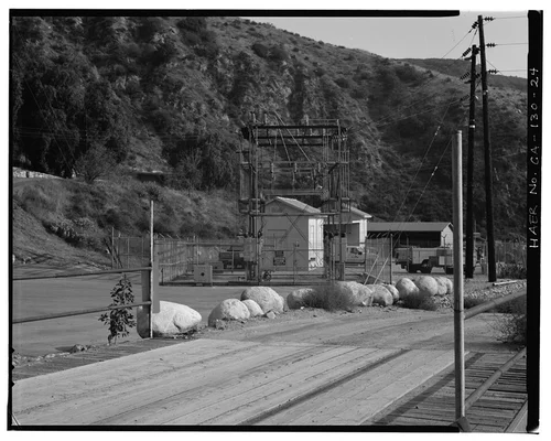  OVERVIEW OF SAR-3 AREA, SHOWING SWITCH RACK, SERVICE YARD, WAREHOUSE, CARPENTER SHOP, AND STORAGE SHED. VIEW TO SOUTH-SOUTHEAST. PANORAMA 2/2. - Santa Ana River Hydroelectric System, Redlands, San Bernardino County, CA