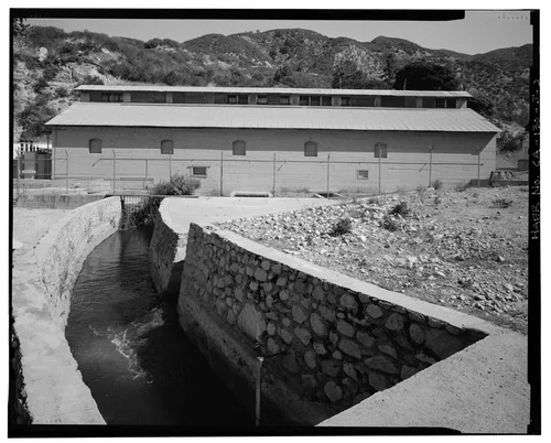  SOUTHWEST ELEVATION AND TAILRACE CHANNEL. VIEW TO NORTHEAST. - Santa Ana River Hydroelectric System, SAR-1 Powerhouse, Redlands, San Bernardino County, CA