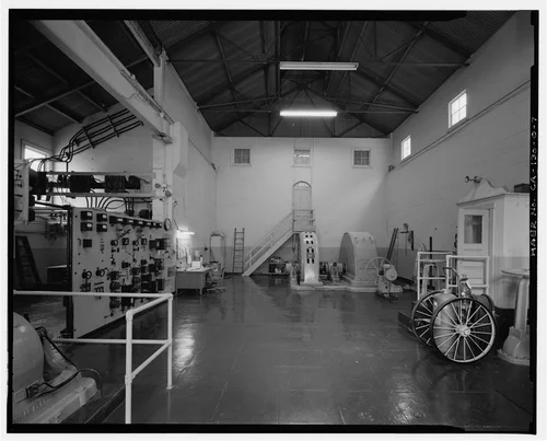 SAR-2, INTERIOR VIEW TO NORTH SHOWING DISCONNECT PANEL, GENERATOR #2, AND TELEPHONE BOOTH. - Santa Ana River Hydroelectric System, SAR-2 Powerhouse, Redlands, San Bernardino County, CA