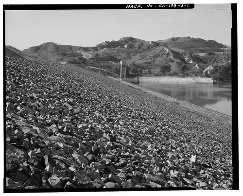  LOOKING WEST TOWARD OUTLET HOUSE ALONG UPSTREAM SIDE OF DAM EMBANKMENT. - Prado Dam, Embankment, Santa Ana River near junction of State Highways 71 & 91, Corona, Riverside County, CA