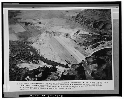  EASTERLY AERIAL VIEW SHOWING THE RIGHT ABUTMENT AND OUTLET CONTROL WORKS IN THE FOREGROUND.... Volume XX, No. 8, September 9, 1940. - Prado Dam, Santa Ana River near junction of State Highways 71 & 91, Corona, Riverside County, CA