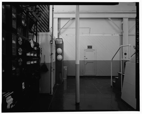  SLIDING DOOR ON WEST WALL, ALSO SHOWING CONTROL PANEL AND OPERATOR'S BOOTH. VIEW TO WEST. - Santa Ana River Hydroelectric System, SAR-3 Powerhouse, Redlands, San Bernardino County, CA