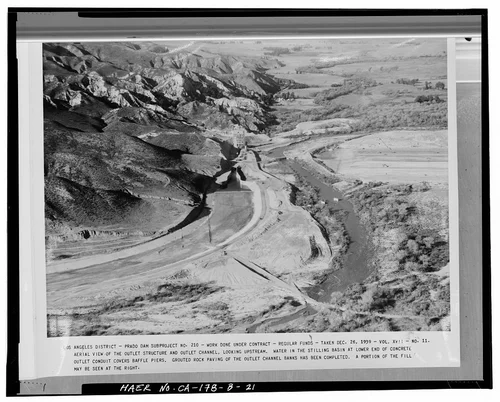  AERIAL VIEW OF THE OUTLET STRUCTURE AND OUTLET CHANNEL, LOOKING UPSTREAM.... Volume XVII, No. 11, December 26, 1939. - Prado Dam, Outlet Works, Santa Ana River near junction of State Highways 71 & 91, Corona, Riverside County, CA