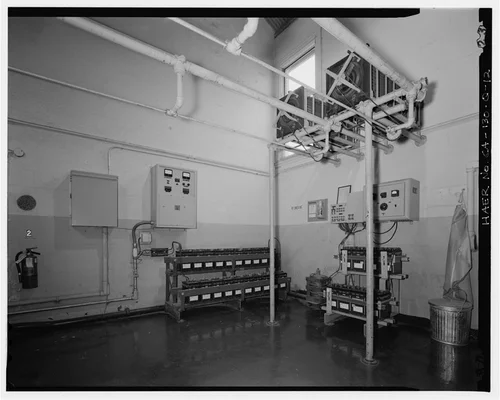  BATTERY BANK AND RHEOSTATS BEHIND DISCONNECT CONTROL PANEL.  VIEW TO SOUTHWEST. - Santa Ana River Hydroelectric System, SAR-2 Powerhouse, Redlands, San Bernardino County, CA