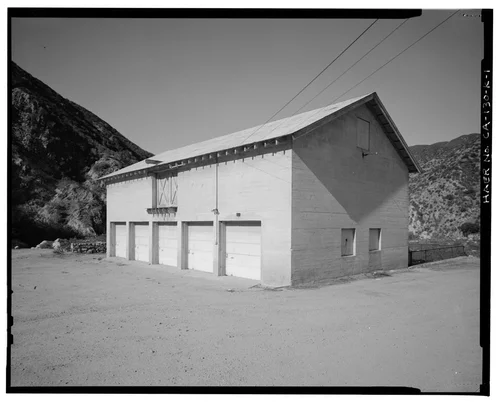  SOUTHEAST (FRONT) AND NORTHEAST ELEVATIONS, LOOKING TO WEST. - Santa Ana River Hydroelectric System, SAR-1 Stable, Redlands, San Bernardino County, CA