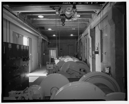  CONTROL HOUSE INTERIOR, LOOKING WEST TO OFFICE, ALSO SHOWING MOBILE CRANE. - Prado Dam, Outlet Works, Santa Ana River near junction of State Highways 71 & 91, Corona, Riverside County, CA