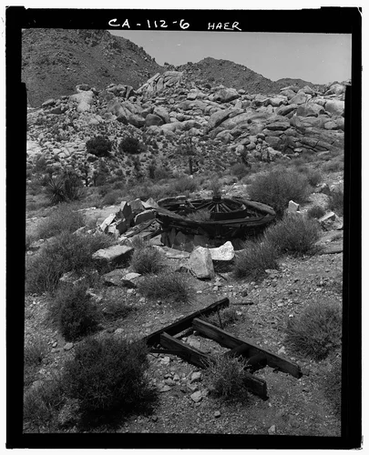  VIEW WEST AT ARRASTRA WITH STRUCTURAL DEBRIS IN FOREGROUND - Pinto Wye Arrastra, Twentynine Palms, San Bernardino County, CA