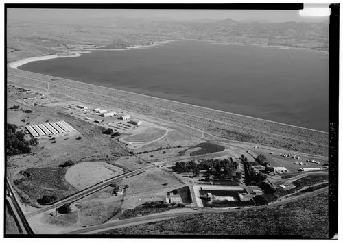  LAKE MATHEWS DYKE STRUCTURE SHOWING WIDTH OF DYKE. WATER SYSTEM OUTLET COMPLEX IN FOREGROUND, LOOKING EAST. - Lake Mathews, East of Route 15, Riverside, Riverside County, CA