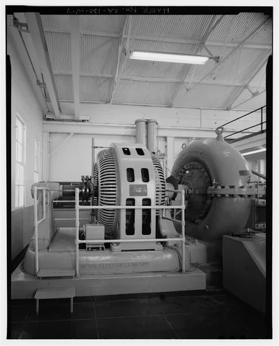 GENERATOR AND TURBINE WATERWHEEL. PANORAMIC VIEW 2/2, LOOKING EAST. - Santa Ana River Hydroelectric System, SAR-3 Powerhouse, Redlands, San Bernardino County, CA