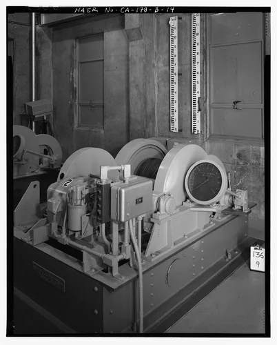  MOTOR NO. 2, WITH GATE OPENING SCALE BEHIND ON WALL. - Prado Dam, Outlet Works, Santa Ana River near junction of State Highways 71 & 91, Corona, Riverside County, CA