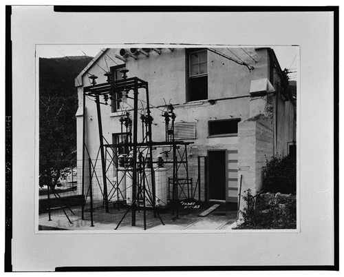  SOUTH ELEVATION, SHOWING ORIGINAL HIGH VOLTAGE GETAWAYS. SCE negative no. 10340, November 1, 1923. Photograph by G. Haven Bishop. - Santa Ana River Hydroelectric System, SAR-3 Powerhouse, Redlands, San Bernardino County, CA