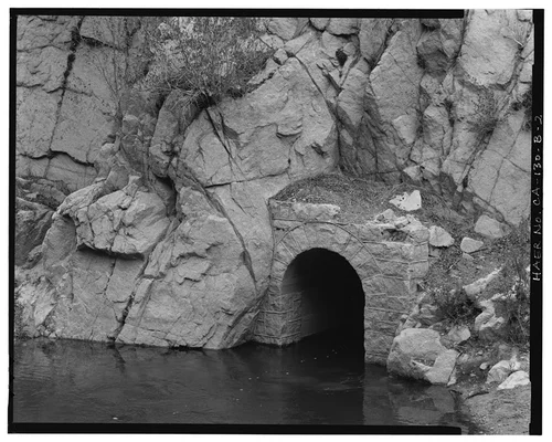  CONFLUENCE POOL, DETAIL OF TUNNEL PORTAL WITH WATER ENTERING FROM SANTA ANA RIVER. VIEW TO NORTHEAST. - Santa Ana River Hydroelectric System, Bear Creek Diversion Dam & Confluence Pool, Redlands, San Bernardino County, CA
