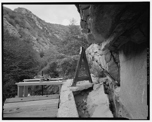  GATE CONTROL WHEEL AND CABLE CAR ANCHOR BOLT. VIEW TO NORTHWEST. - Santa Ana River Hydroelectric System, Santa Ana River Diversion Dam, Redlands, San Bernardino County, CA