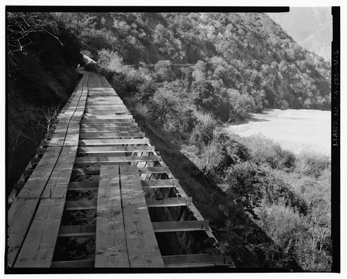  PLANK WALKWAY ATOP WARM SPRINGS CANYON FLUME. VIEW TO WEST-SOUTHWEST. - Santa Ana River Hydroelectric System, Warm Springs Canyon-SAR-3 Flumes, Redlands, San Bernardino County, CA