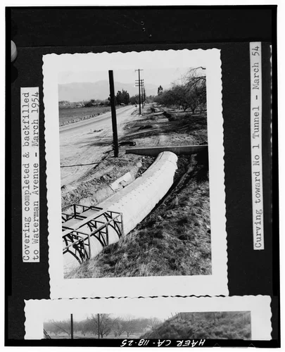  Photocopy of photograph (original print at Gage Canal Company Office), photographer unknown, March 1954. VIEW OF THE GAGE IRRIGATION CANAL, CONCRETE 'COVERING COMPLETED & BACKFILLED TO WATERMAN AVENUE...CURVING TOWARD NO. 1 TUNNEL' - California Citrus Heritage Recording Project, Riverside, Riverside County, CA