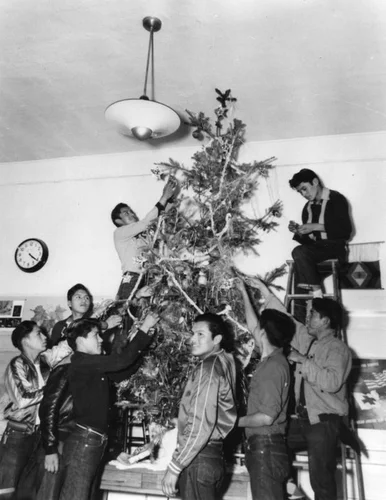 Navajo boys decorating Christmas tree