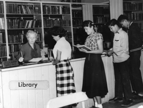 Navajo students in library at Sherman Institute