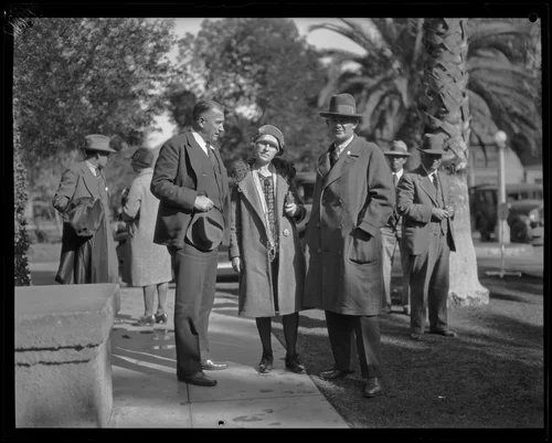 Mrs. Northcott standing with two men outside, Riverside, circa 1928