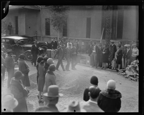 Gordon Northcott escorted by police down the street, Riverside, circa 1928