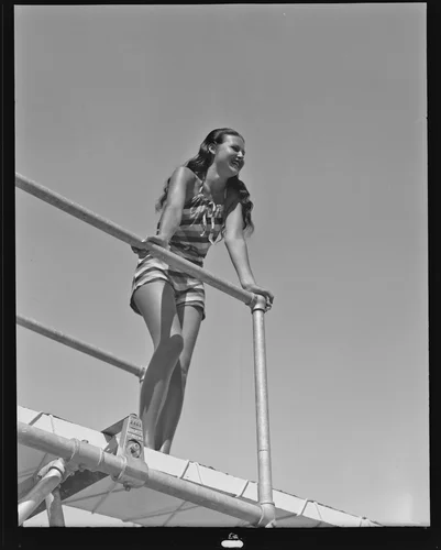 Patricia Allen gazes from a diving board, Palm Springs, 1936