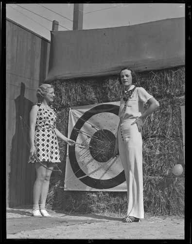 Virginia Chatterton and Barbara Riley survey their archery results, Palm Springs, 1936