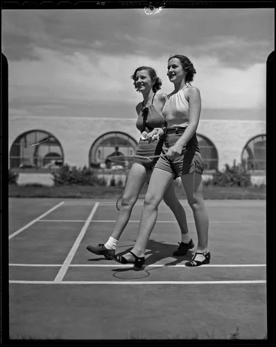 Marilyn Langworthy and Barbara Mayfield after a game of badminton, Palm Springs, 1936