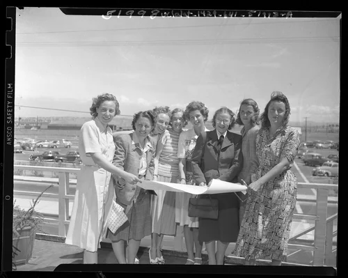 Group portrait of eight women pilots before they leave Palm Springs for 1948 Powder Puff Derby