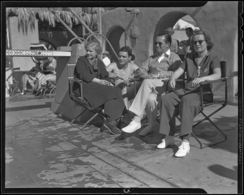 Burton Green, Miles Gray, Dr. John Lordan and Martha Woodin relax poolside at El Mirador, Palm Springs, circa 1936