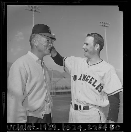Pitcher Aubrey Gatewood and football player Don Hutson at Angels' training camp in Palm Springs, Calif., 1964