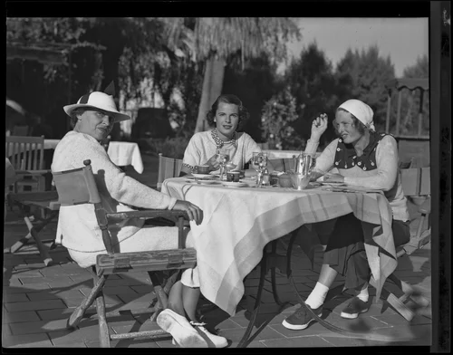 Mrs. George J. Hill, Sr., Mrs. George J. Hill, Jr. and Mrs. Frederick F. Payne enjoy a luncheon at the Desert Inn, Palm Springs, 1935