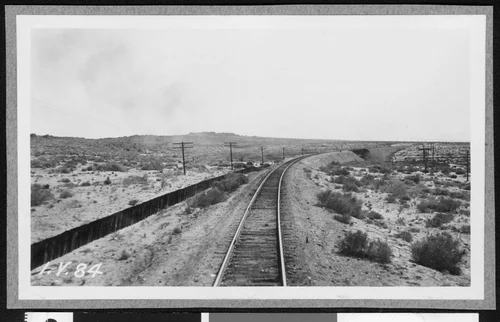 Railroad track on east side of the Salton Sea, showing a trestle in the distance, ca.1910