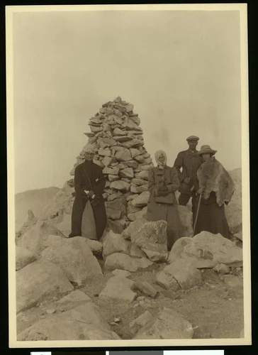 Four hikers on the summit of San Gorgonio Mountain, 1900-1915