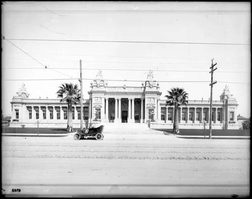 Exterior view of the Court House in Riverside, with an automobile parked in front, ca.1910