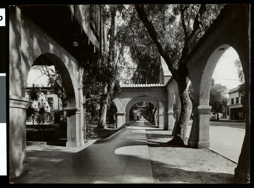 Interior view of an arcade outside Frank Miller's Glenwood Mission Inn in Riverside, ca.1910