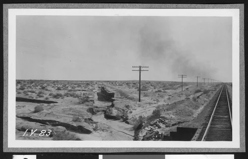 Railroad track on east side of the Salton Sea, showing a drainage system running diagonal to it, ca.1910
