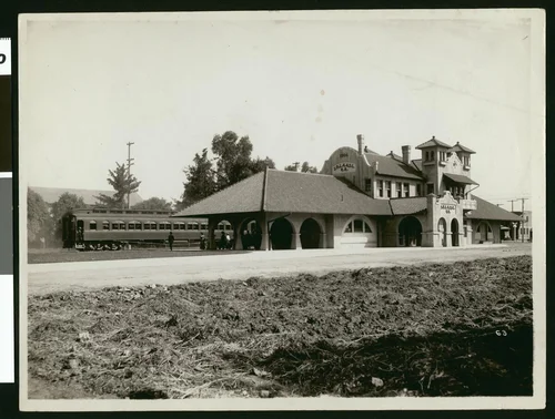 Exterior view of the Salt Lake Railroad Depot in Riverside, showing a train, ca.1910