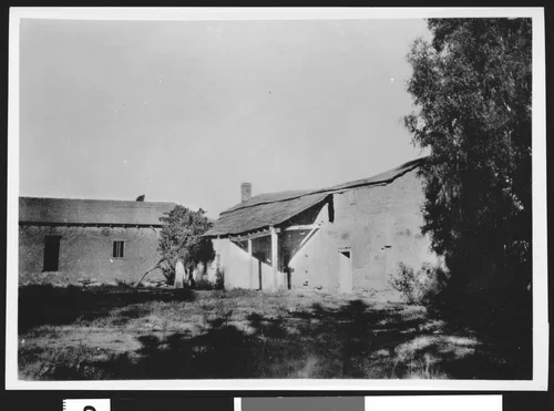 Exterior view of the Rubidoux adobe in Riverside, showing the granary and winery at left, ca.1890